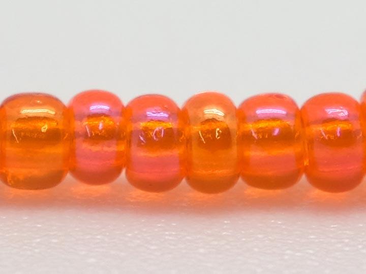 10/0 Seedbead Translucent Iris Orange (500 g bag) glass beads