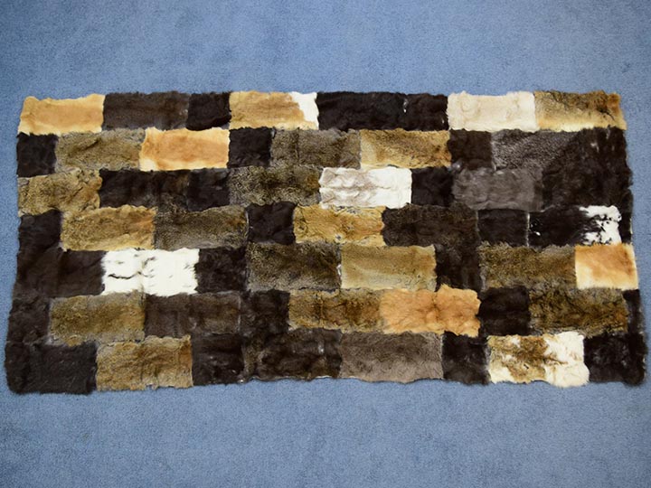 Lot - 2 Rabbit pelt blankets. Each “blanket” is made up of 12 rabbit pelts  sewn together. Overall size of 1 blanket is approximately 43” x 20” .